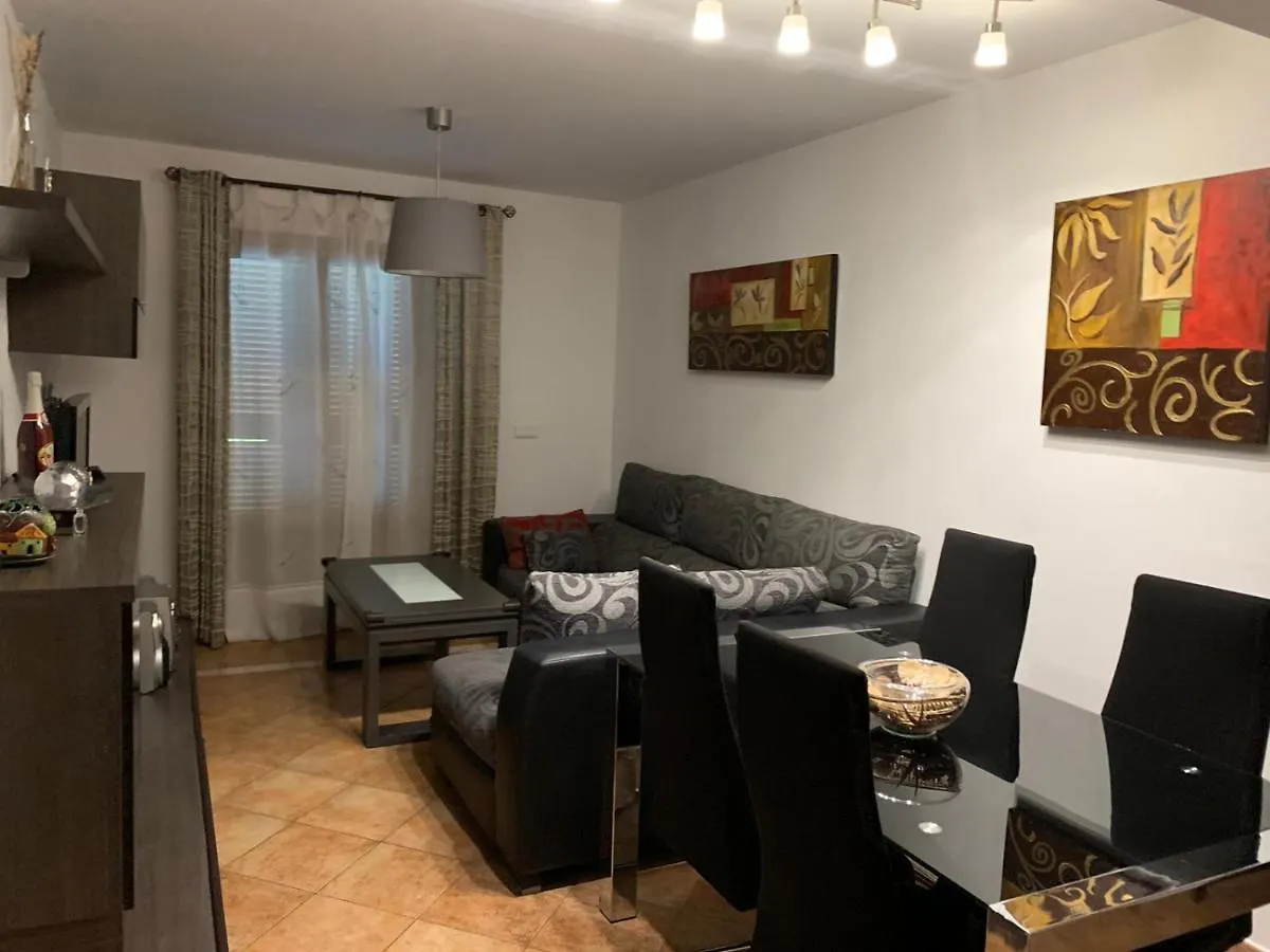Apartamento con jardín privado y acceso a piscina Huelva