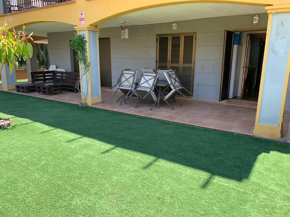 Apartamento con jardín privado y acceso a piscina Huelva